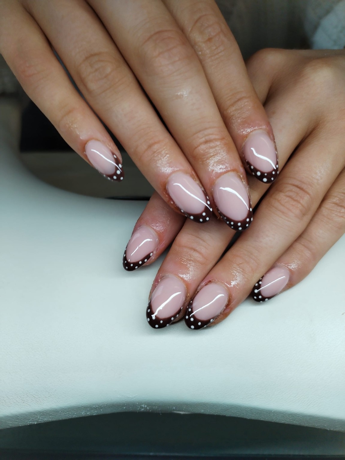 Chocolate French tips with white dot detail by Moy Nails