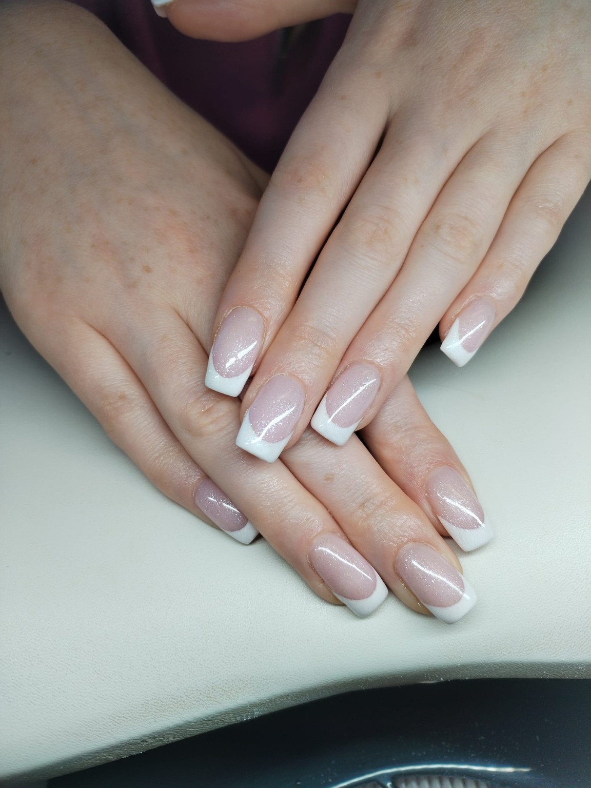 Soft pink square nails with classic white French tips by Moy Nails