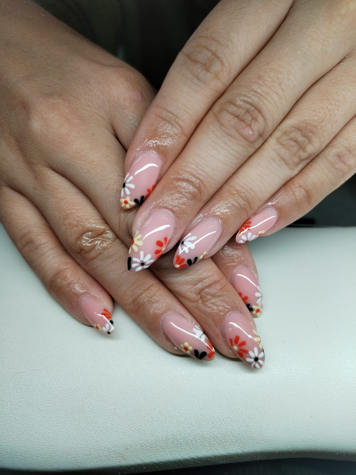 Pink manicure with hand-painted floral nail art by Moy Nails